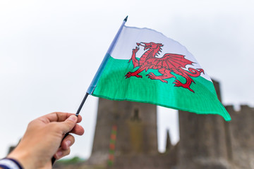 Waiving Welsh flag with red dragon in Pemborke castle, Wales