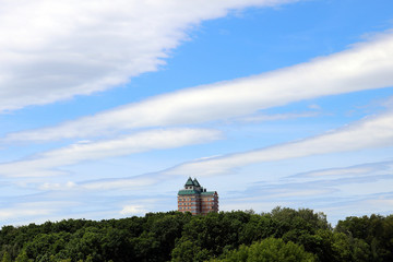 a skyscraper on a hill