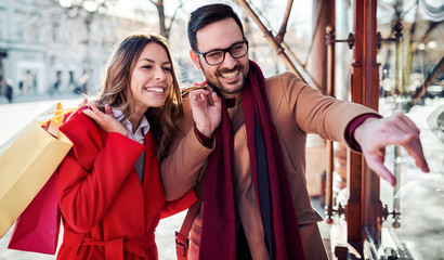 Shopping time. Young couple in shopping. Consumerism, love, dating, lifestyle concept