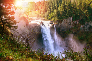 Morning Sunrise Over Snoqualmie Falls in Washington State. The waterfall is sacred to the Snoqualmie native Indians who have lived for centuries in the Snoqualmie Valley.
