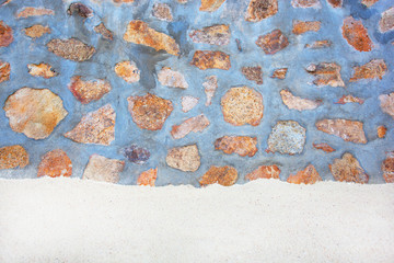 Sand with stones in cement Wall.