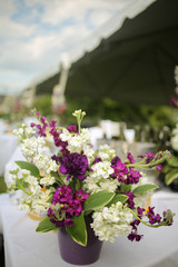 Fototapeta na wymiar Floral Event Centerpiece: Purple, Fuchsia, Magenta, and Green Flower Arrangement