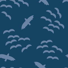 Bird silhouettes light blue on a dark blue background. Seamless vector pattern. Part of my "Let's go glamping!" collection.