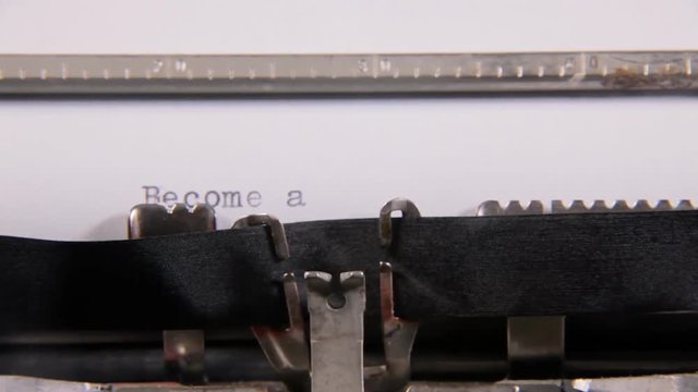 Typing the words Become a Sponsor on a blank paper sheet with an old vintage typewriter. With diegetic audio.
