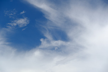 Naklejka na ściany i meble White cloud in blue sky