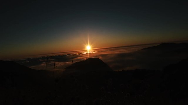 At 1850m over sea level, sun setting into the clouds in a beautiful time lapse