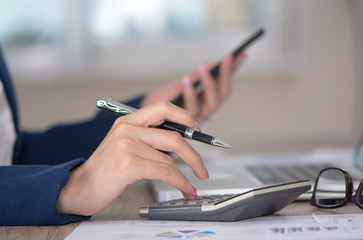 Fototapeta premium Photo young woman business working calculating Finance