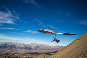 Fototapeta na wymiar Hang gliding high in the mountains