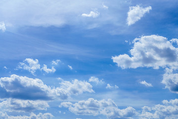 Naklejka na ściany i meble Blue, fluffy clouds in the sky. Background of nature, stratosphere.