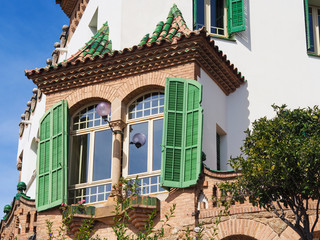 Green windowed house.
