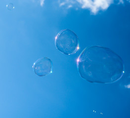 Soap bubbles and blue skies