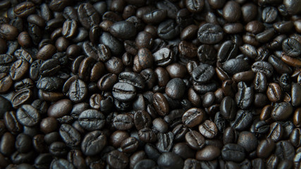 The  coffee roasted on wood close up image for background.