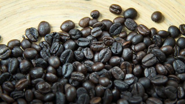 The  coffee roasted on wood close up image for background.