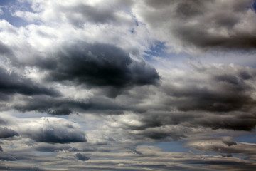 Dark clouds in a blue sky