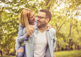 Playful couple at park.