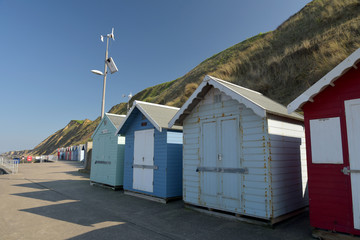 Fototapeta na wymiar Beach huts on seafront at Sheringham, Norfolk
