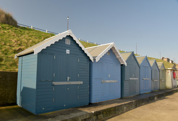 Fototapeta na wymiar Beach huts on seafront at Sheringham, Norfolk