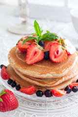 Summer breakfast with homemade punkakes of wholemeal flour and strawberries, selective focus