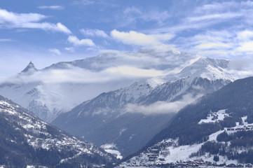 peak mountain under clouds 