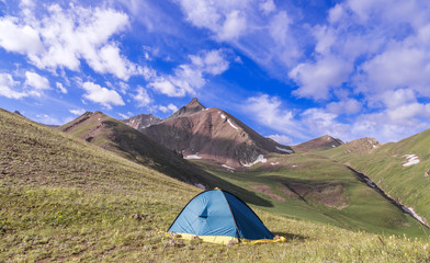 Camping in the mountains with spectacular clouds at the summer season.