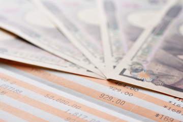 Close up saving account passbook and new Japanese yen