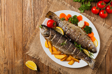 Grilled whole trout. Served with baked potatoes.