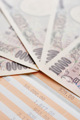 Close up saving account passbook and new Japanese yen