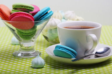 A cup of coffee and macaroons ready for breakfast