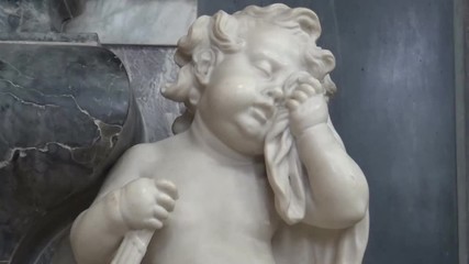 A marble statue of a crying angel in a Church, York, United Kingdom - Powered by Adobe
