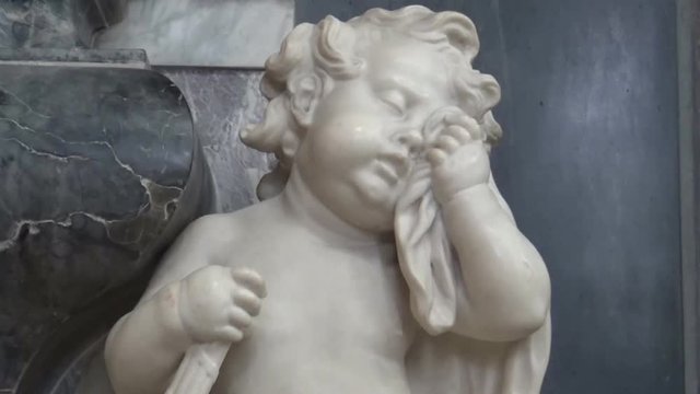 A marble statue of a crying angel in a Church, York, United Kingdom
