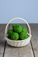 fresh bergamot fruit on wooden table
