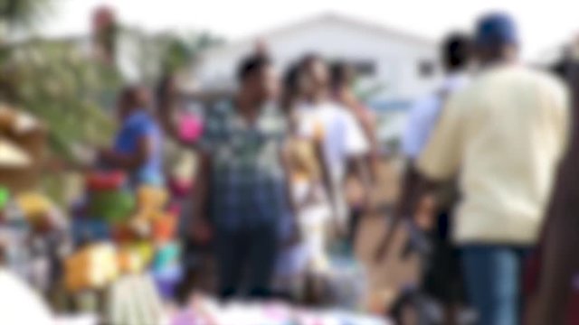 ACCRA,  GHANA - CIRCA JUNE 2017 : Scenery of LOCAL PEOPLE walking in blurred.