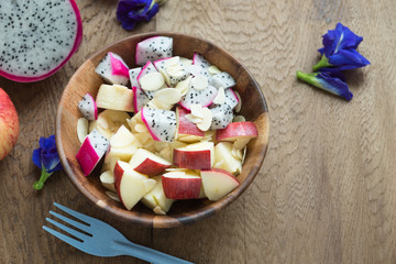 Clean food healthy food concept , mixed fruit with apple, dragon fruit, banana and almond