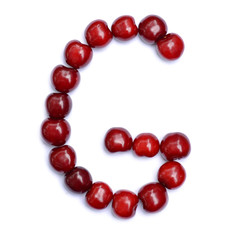 Letter G made with cherries to form a letter of the alphabet. Berry letters on a white background.