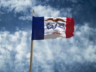 Iowa flag USA flag Silk waving flag made transparent fabric of Iowa US state with wooden flagpole gold spear on background sunny blue sky white smoke clouds real retro photo 3d illustration