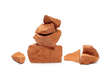 Shattered brick pieces isolated on white background