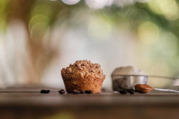 Mocha muffins and ingredients on a rustic wooden table