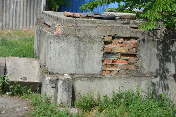 Brickwork with chipped concrete plaster on reinforced concrete slabs ...