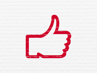 Social network concept: Painted red Thumb Up icon on White Brick wall background