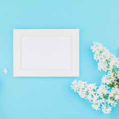 Blank frame mockup with white flowers