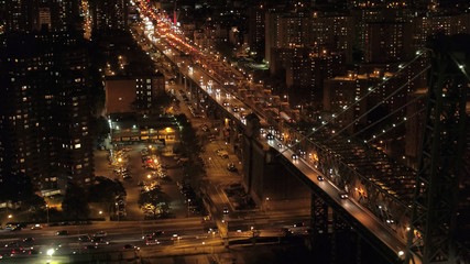 Fototapeta na wymiar AERIAL: Dense traffic on Williamsburg Bridge highway leading to Manhattan, NYC