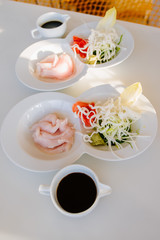 A dish from raw fish meat with vegetables
