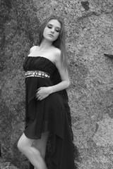 sad girl in a dress in black and white photo
