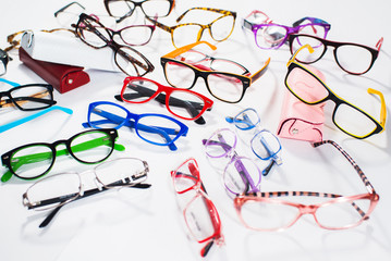 Set of many different colored glasses on white background