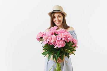Young tender woman in blue dress, hat holding bouquet of beautiful pink peonies flowers isolated on white background. St. Valentine's Day, International Women's Day holiday concept. Advertising area.