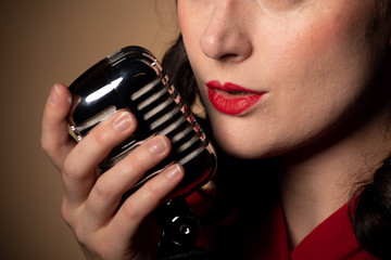 Vintage female singer with microphone