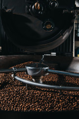 Roasting and mixing process in traditional coffee roaster cylinder