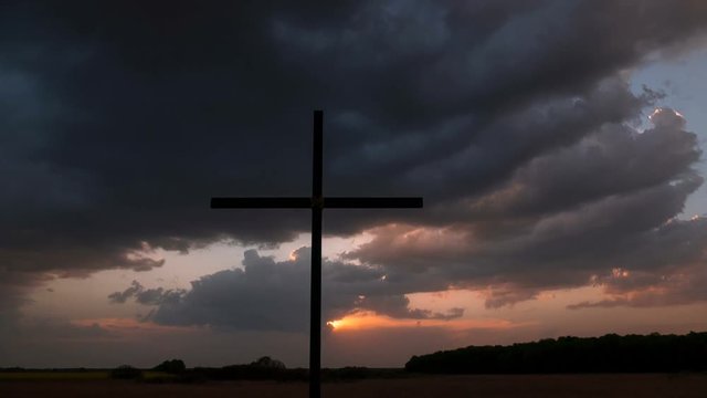 4k.Time-Lapse, Sunset, clouds  and  Christian Cross.
