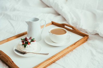 Obraz na płótnie Canvas Cozy home breakfast in bed in white bedroom interior 