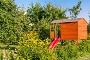 Summer children house in the garden, cottage playhouse for kids © alicja neumiler